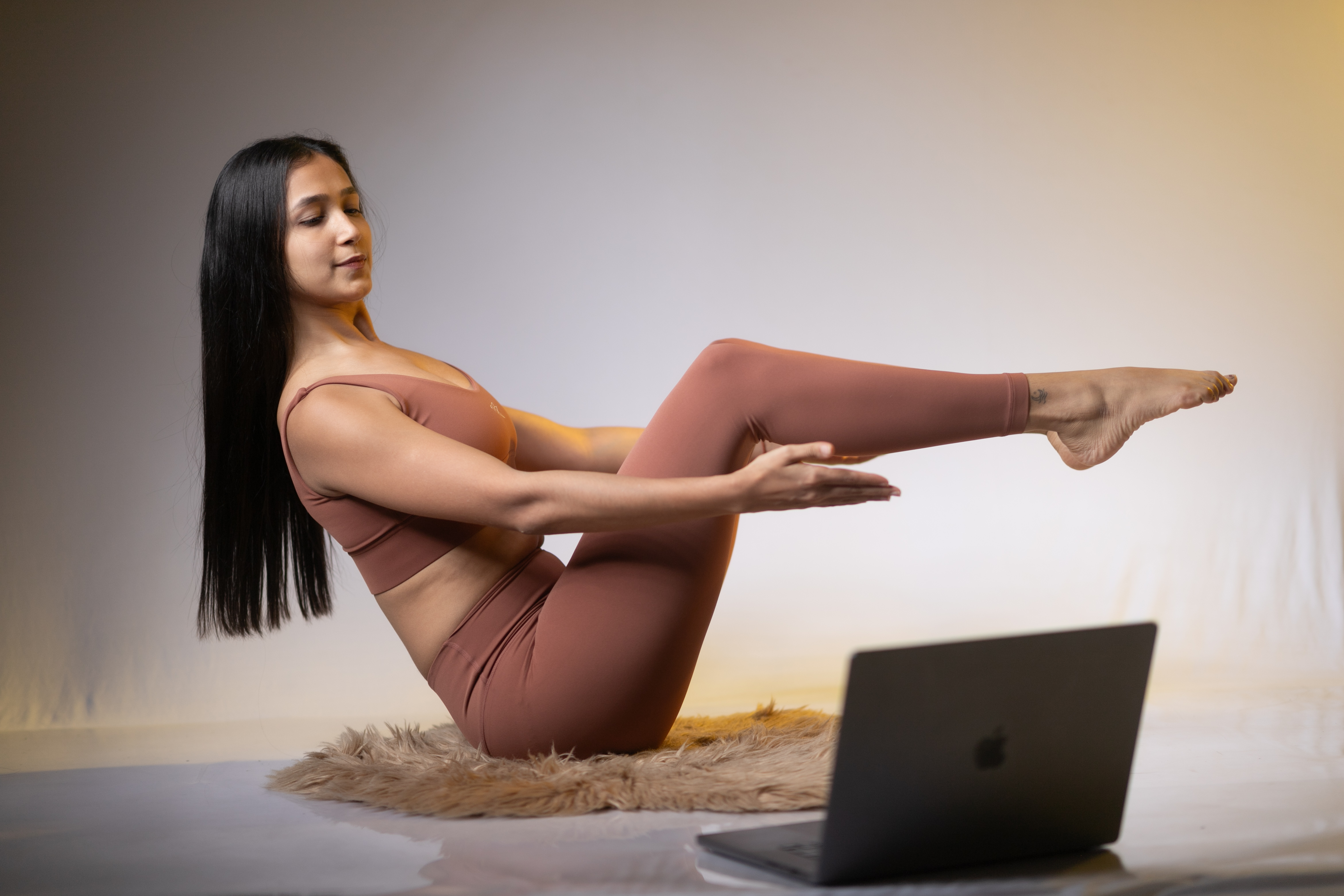 Anjali Pandey teaching intermediate yoga flow in a serene, warm studio setting with natural light
